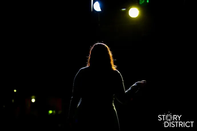 Coby Jones speaking in dark, dramatic light